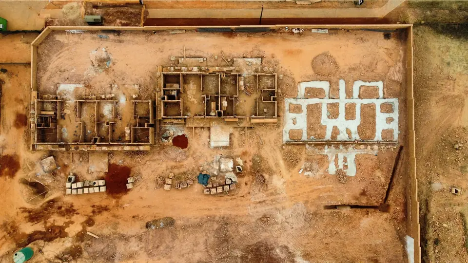 Top-down drone view of foundations and current building footprints at iQ Bronberg