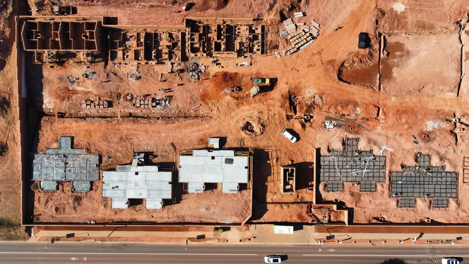Vertical drone view of building footprints and slab construction at iQ Bronberg