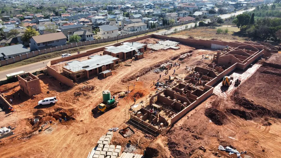 Oblique aerial view of active Phase 1 building work at iQ Bronberg
